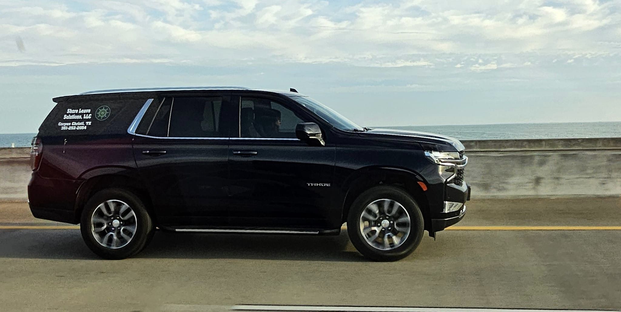 Shore Leave Solutions LLC Vehicle in front of the sea port