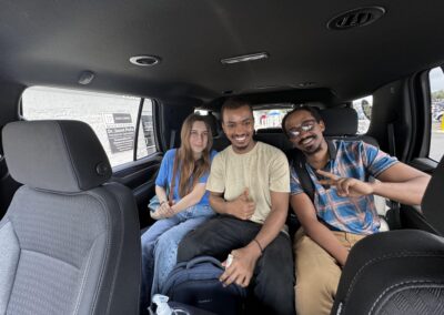 Seafarer Clients of Shore Leave Solutions LLC posing inside the company vehicle in cristi corpus