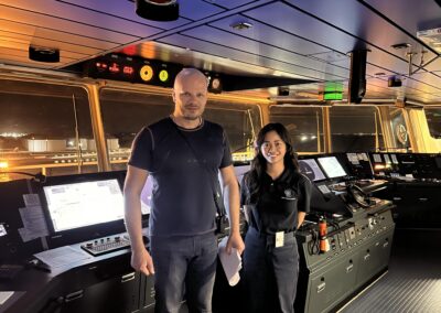 The CEO and a client of Shore Leave Solutions LLC posing inside th captains deck